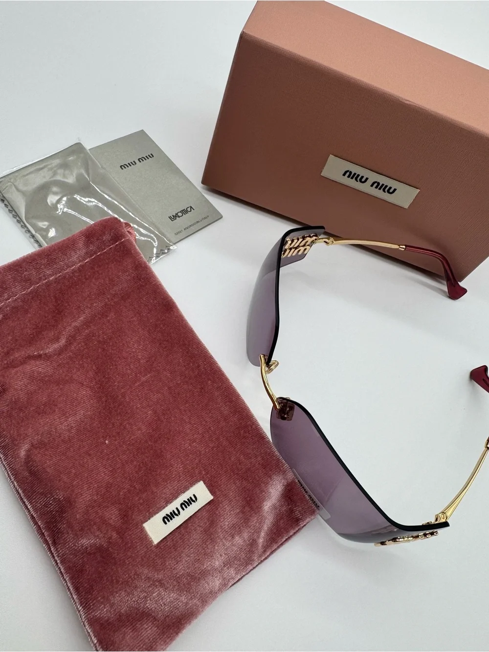 Miu Miu Purple Rimless Sunglasses with Gold Accents